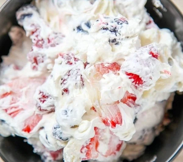 Delicious cheesecake salad with fresh fruits and creamy dressing.