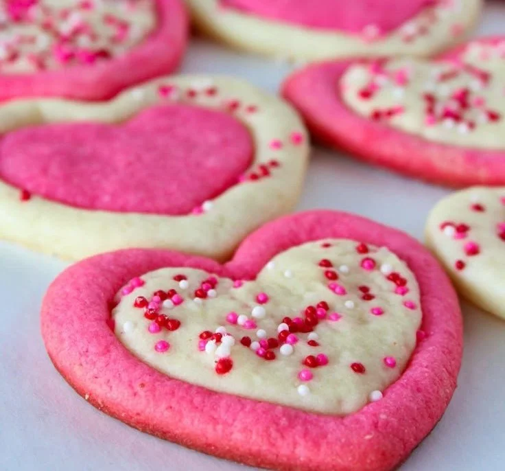 Delicious cream cheese sugar cookies with strawberry buttercream frosting