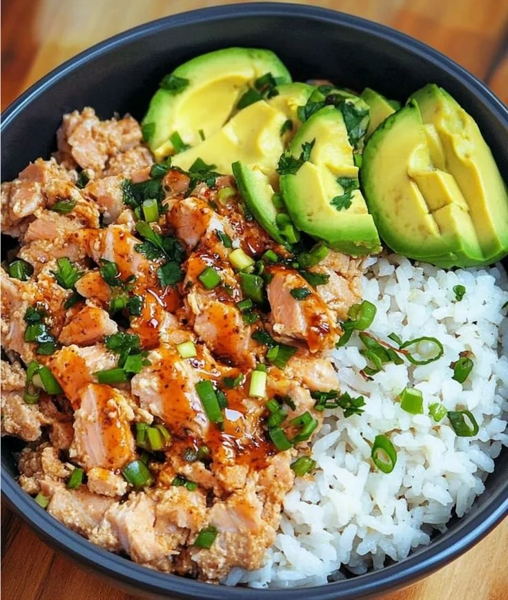 Crispy canned salmon patties served with lemon and herbs on a plate