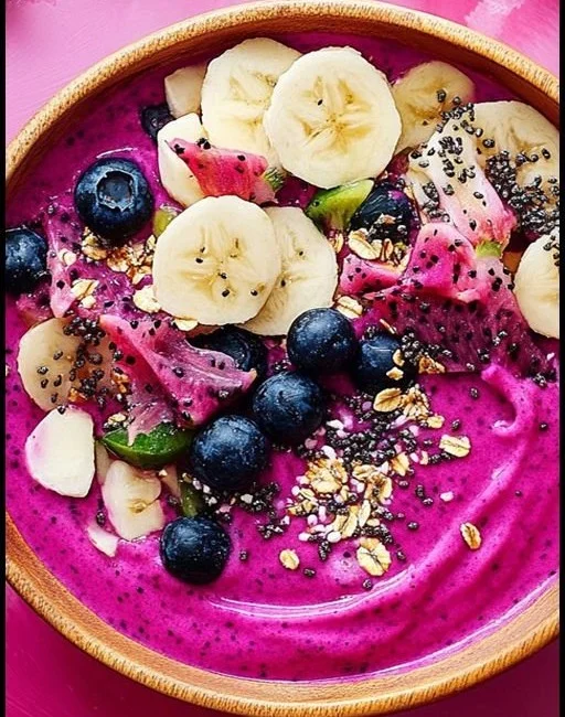 Colorful Dragon Fruit Smoothie Bowl topped with fresh fruits and seeds