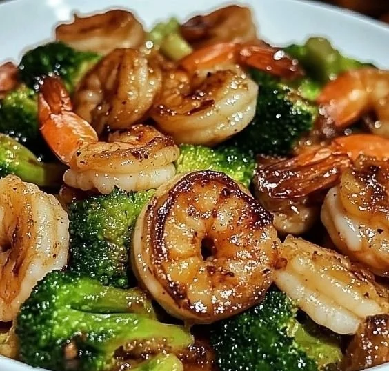 High-protein honey garlic shrimp served with vegetables on a plate