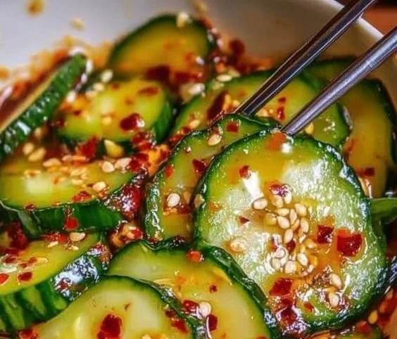 Korean Cucumber Salad served in a bowl with fresh vegetables and dressing.