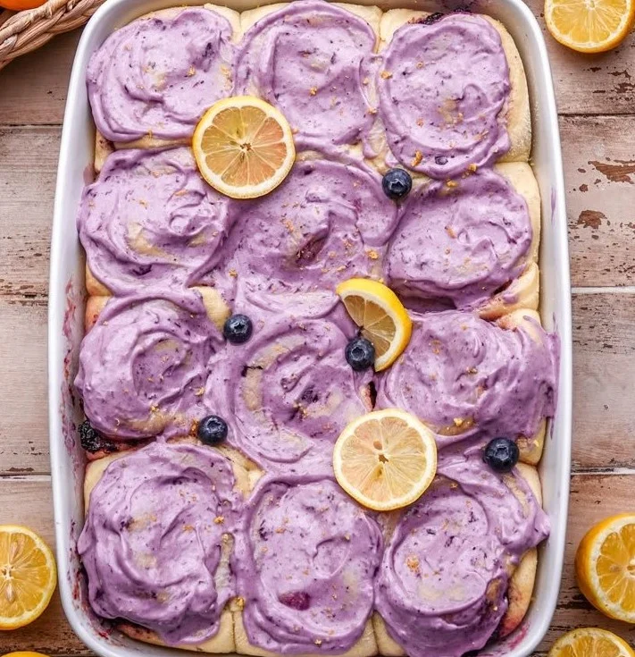 Lemon Blueberry Rolls with fresh blueberries and lemon zest on a plate
