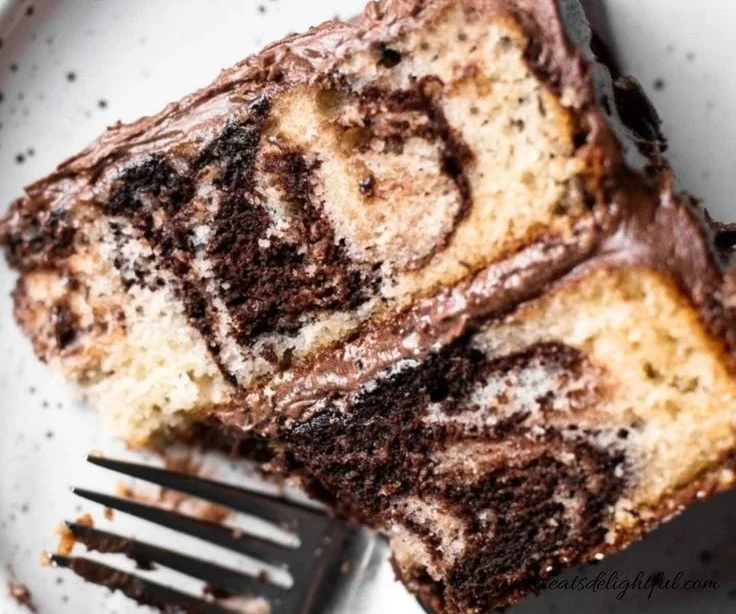 Beautifully sliced marble cake showcasing chocolate and vanilla swirls