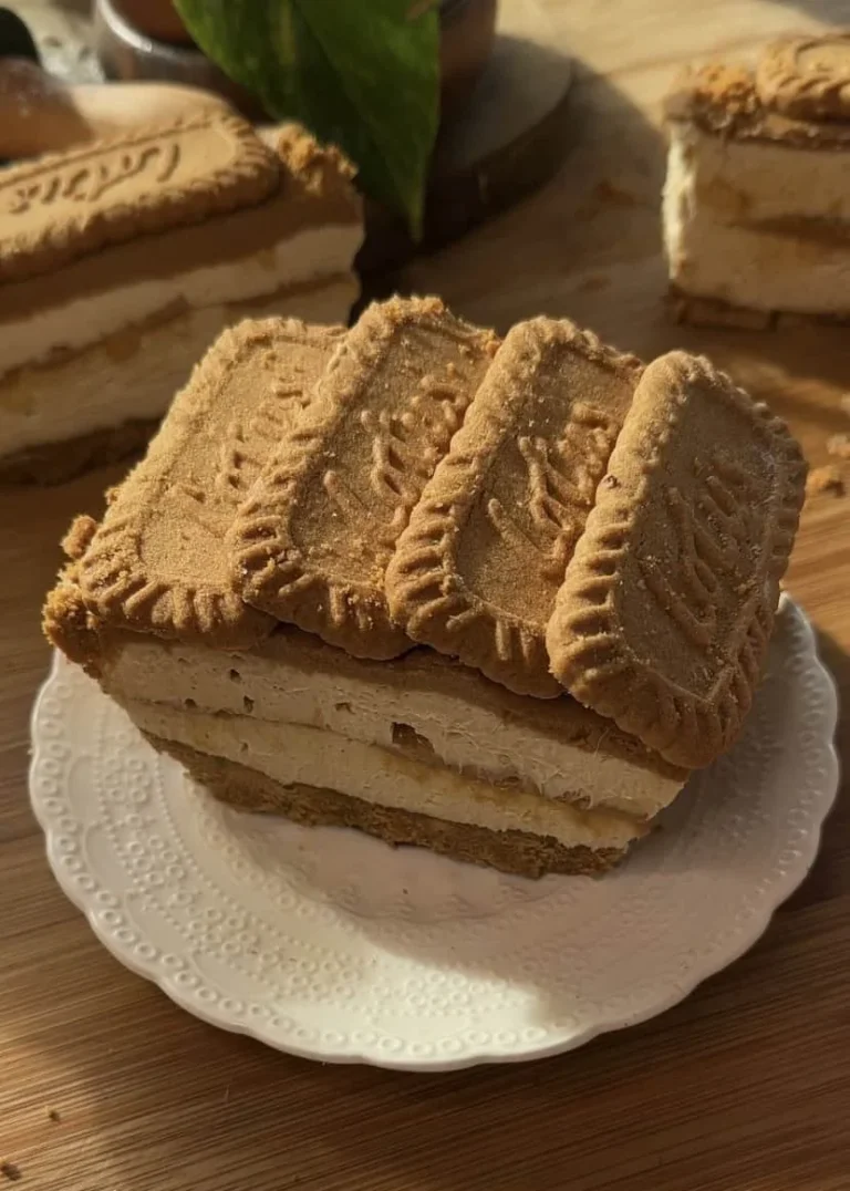 No bake Biscoff cheesecake bar topped with crumbled Biscoff cookies