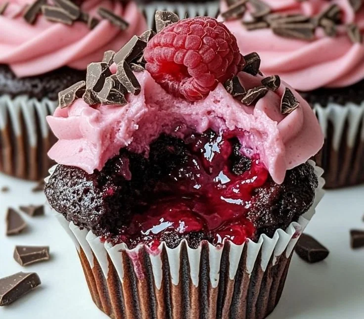 Raspberry chocolate lava cupcakes with gooey centers and fresh raspberries