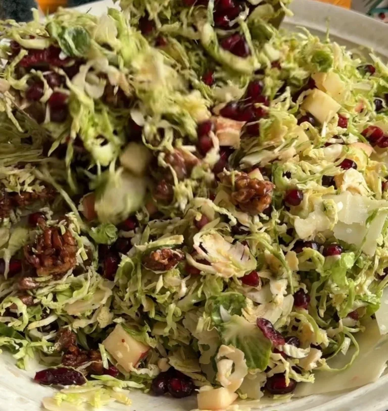 Shaved Brussels sprout salad with pomegranate seeds and candied pecans