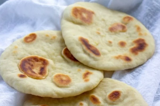 Homemade sourdough naan made from sourdough discard