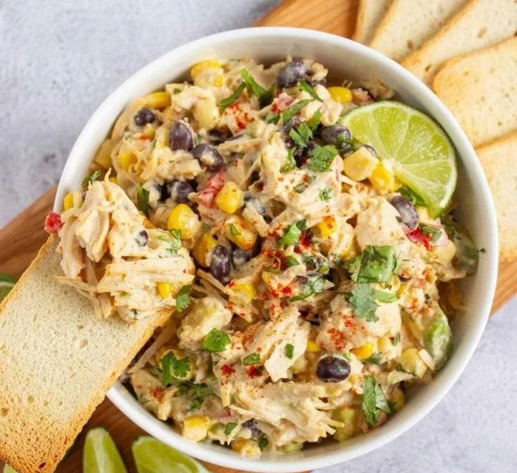 Delicious Southwest Chicken Salad topped with fresh veggies and grilled chicken.