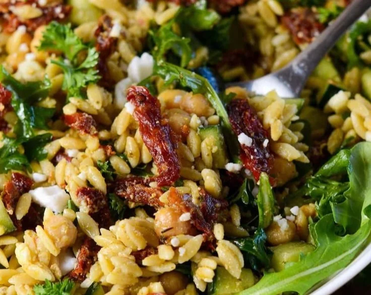 Delicious Sun Dried Tomato Orzo Pesto Salad served in a bowl