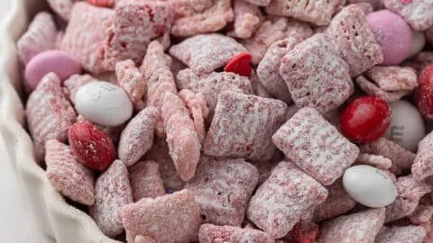 Valentine's Day themed Muddy Buddies recipe with heart-shaped sprinkles.