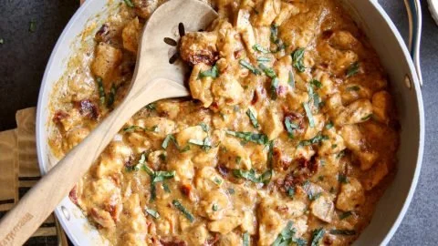 Delicious Whole30 Marry Me Chicken served with fresh herbs and vegetables