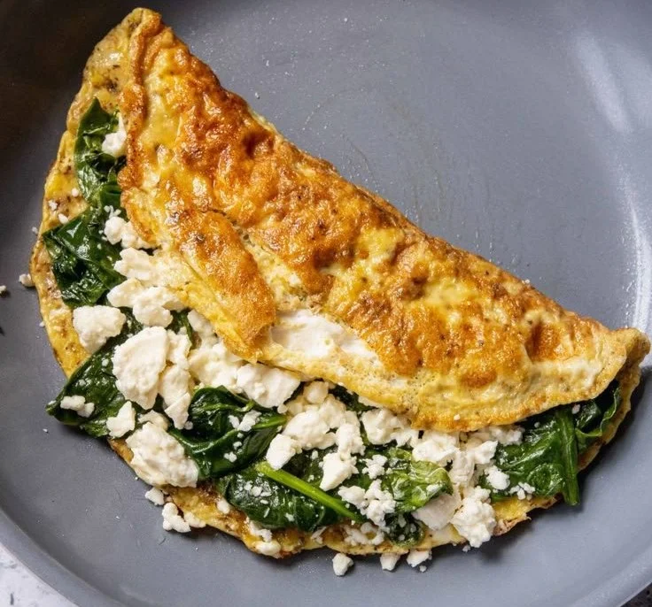 Quick and healthy spinach feta omelet served on a plate