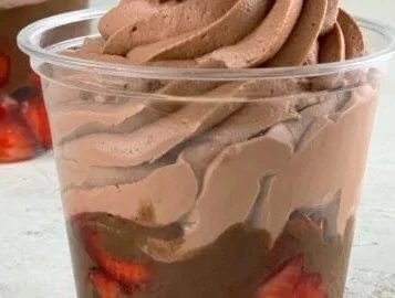 Fluffy yogurt chocolate-covered strawberries served on a plate