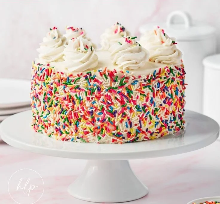 Gluten-free funfetti birthday cake with colorful sprinkles and frosting