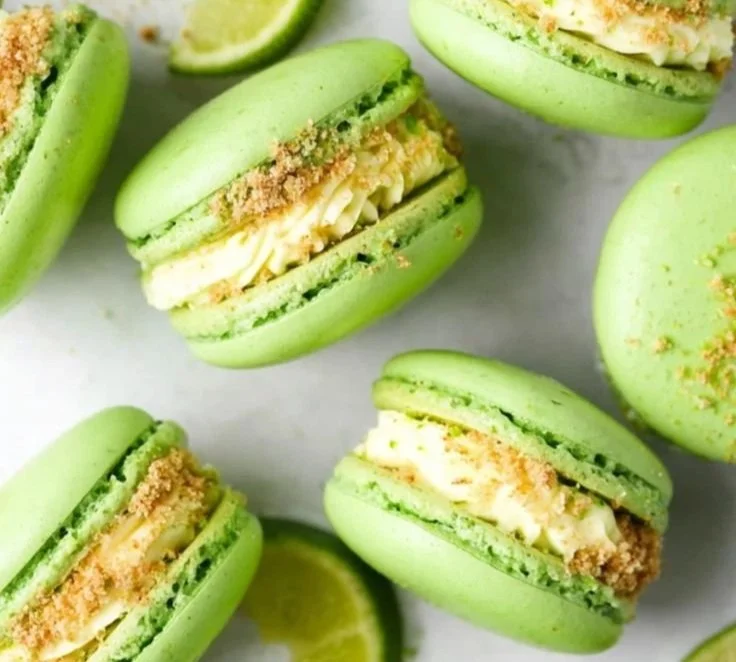 Delicious Key Lime Pie Macarons on a plate, showcasing vibrant lime color.