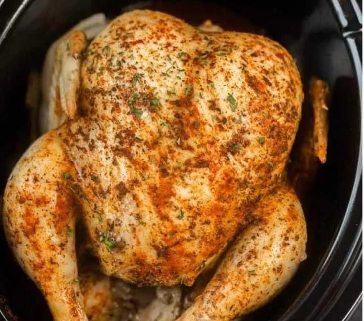 Delicious slow cooker whole chicken seasoned and ready to serve