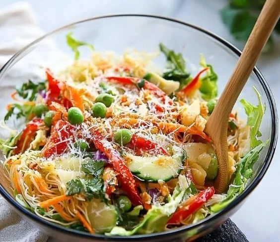 Delicious and colorful Spring Roll Salad with fresh vegetables and herbs.