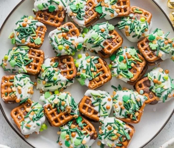 St. Patrick's Day themed Rolo pretzel candy with green decorations