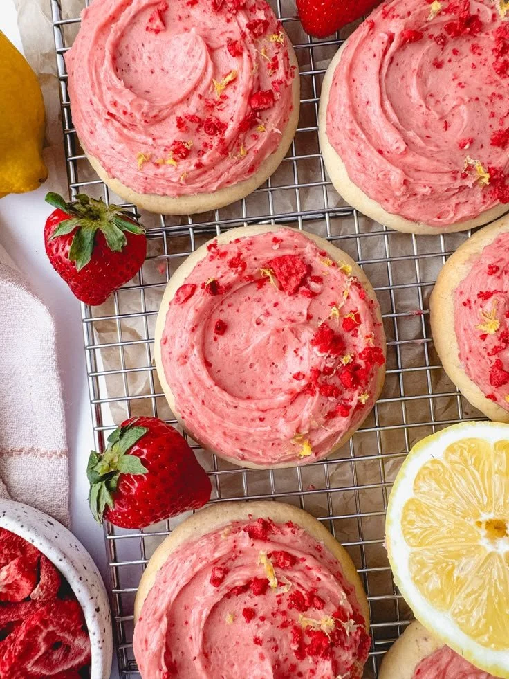 Freshly baked strawberry lemonade cookies on a rustic wooden table