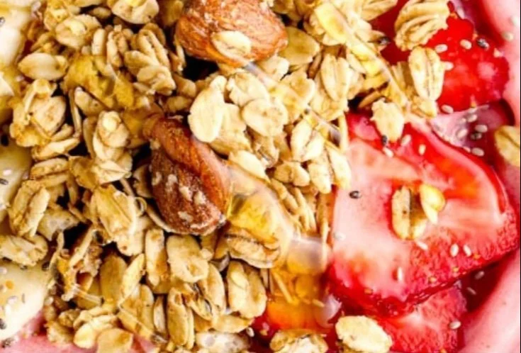 Delicious Strawberry Smoothie Bowl topped with fresh fruits and nuts