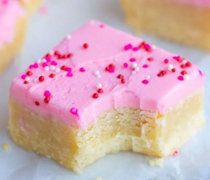 Delicious homemade sugar cookie bars on a rustic wooden table