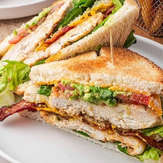 Delicious Chicken Club Sandwich with bacon, lettuce, and tomato