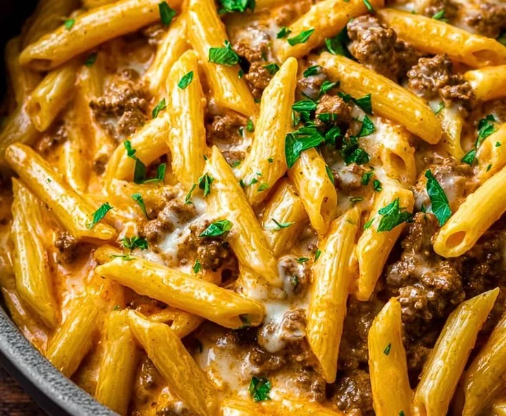 Creamy high protein beef pasta dish with fresh ingredients and a rich sauce