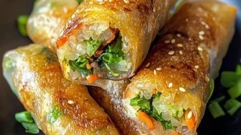 Crispy rice paper spring rolls filled with fresh vegetables and herbs