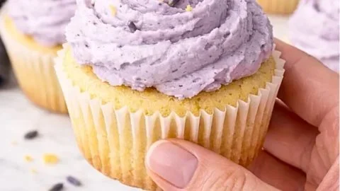 Fresh and fluffy lemon lavender cupcakes with icing on a plate