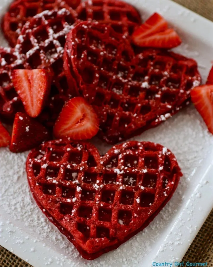 Gluten-free red velvet waffles served with cream cheese drizzle