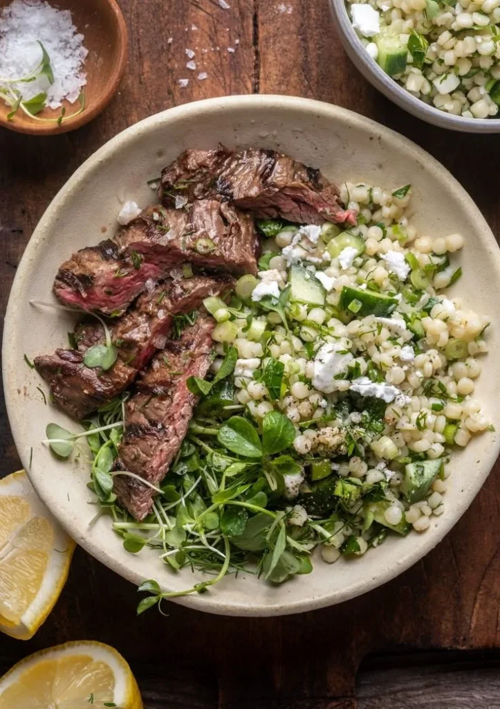 Grilled skirt steak served with a refreshing pearl couscous salad