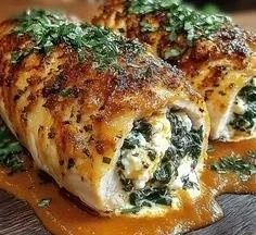 Herbed ricotta stuffed chicken rolls ready to serve, delicious and flavorful meal.
