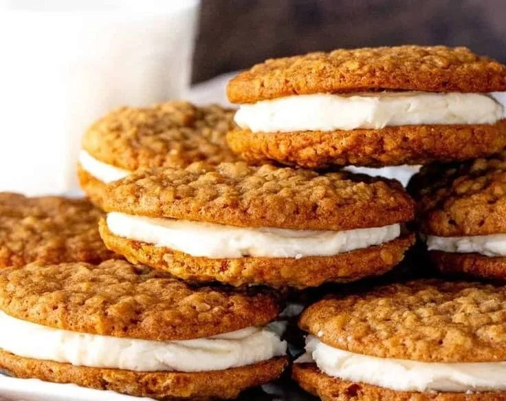Delicious homemade oatmeal cream pies with creamy filling between soft cookies