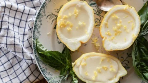 Delicious Lemon Posset in a glass dessert cup, garnished with lemon zest.