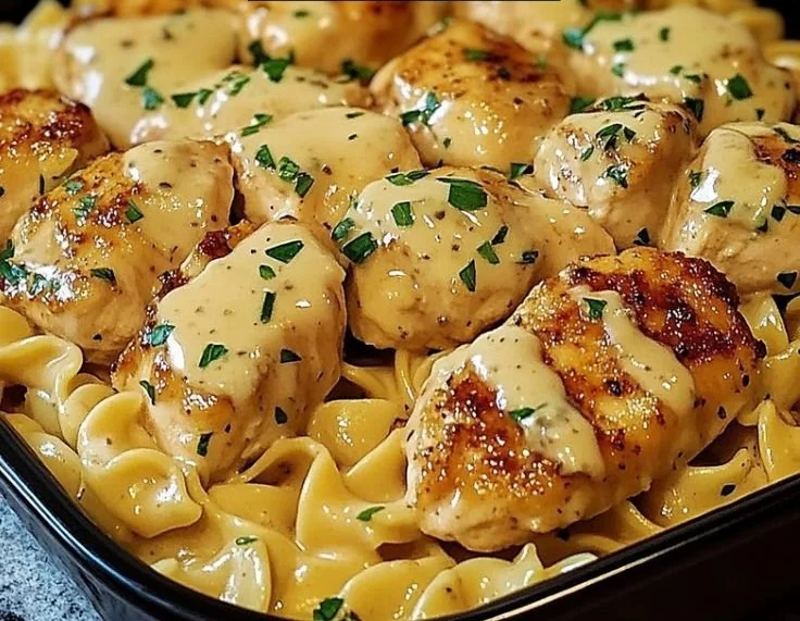 One-pan chicken served with buttered noodles in a savory dish