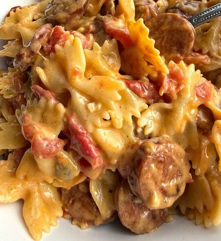 Creamy Cajun sausage pasta served in a bowl, garnished with parsley