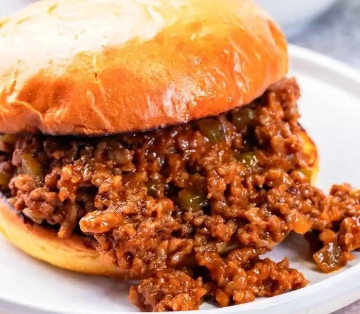 Delicious Sloppy Joes served on a plate with toppings