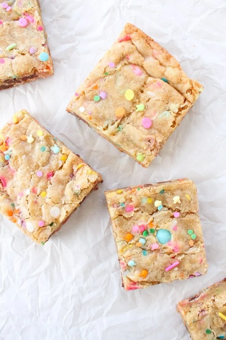 Delicious Spring Funfetti Blondies with colorful sprinkles on a white plate