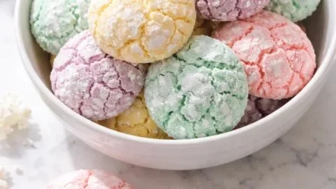 Springtime crinkle cookies with powdered sugar topping and vibrant colors