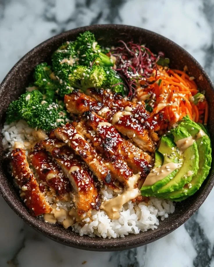 Delicious sticky chicken bowls recipe with colorful vegetables and rice