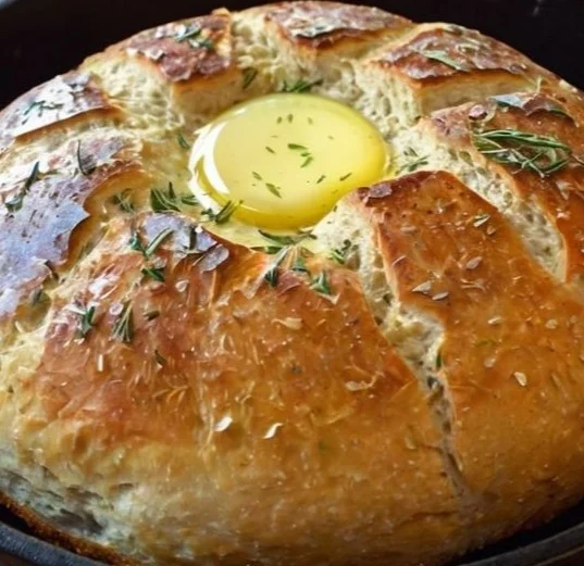 Freshly baked stovetop bread in a skillet on a kitchen countertop