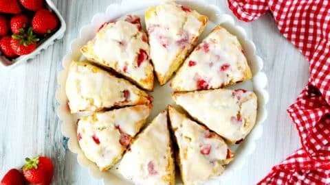 Freshly baked strawberry scones with strawberries on the side