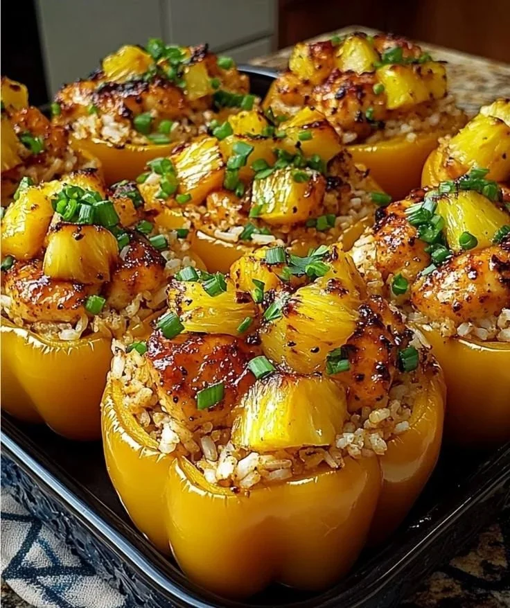 Teriyaki pineapple chicken and rice stuffed peppers on a plate