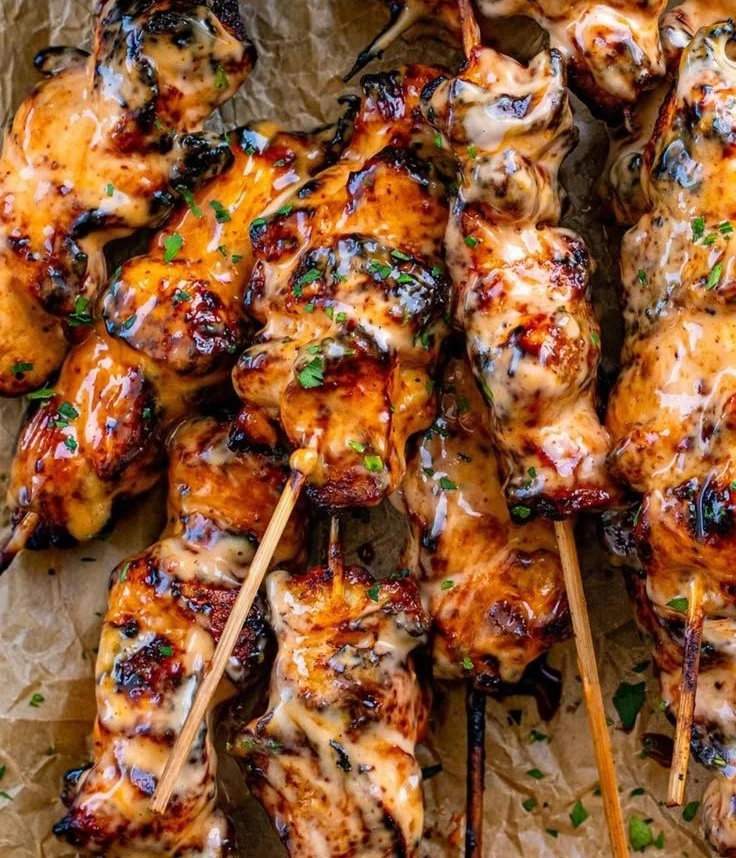 Delicious Bang Bang Chicken Skewers on a serving plate