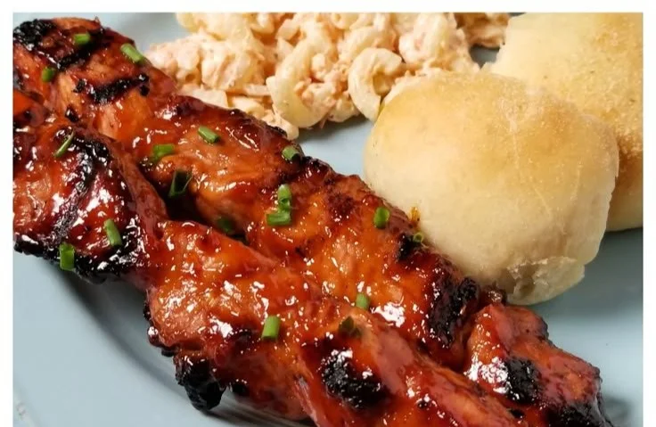 BBQ Pork Skewers marinated in Filipino BBQ sauce on a grill