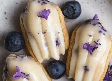 Blueberry lavender vegan madeleines on a white plate