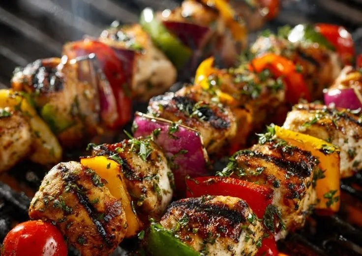 Grilled chicken kabobs skewered with colorful vegetables, ready to serve.
