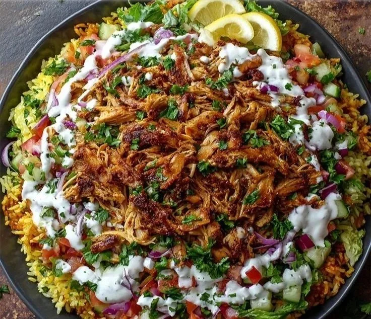 Delicious Chicken Shawarma Crispy Rice Salad topped with fresh vegetables