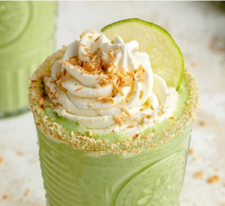 Creamy Coconut Key Lime Pie Smoothie with vibrant green color and lime slices